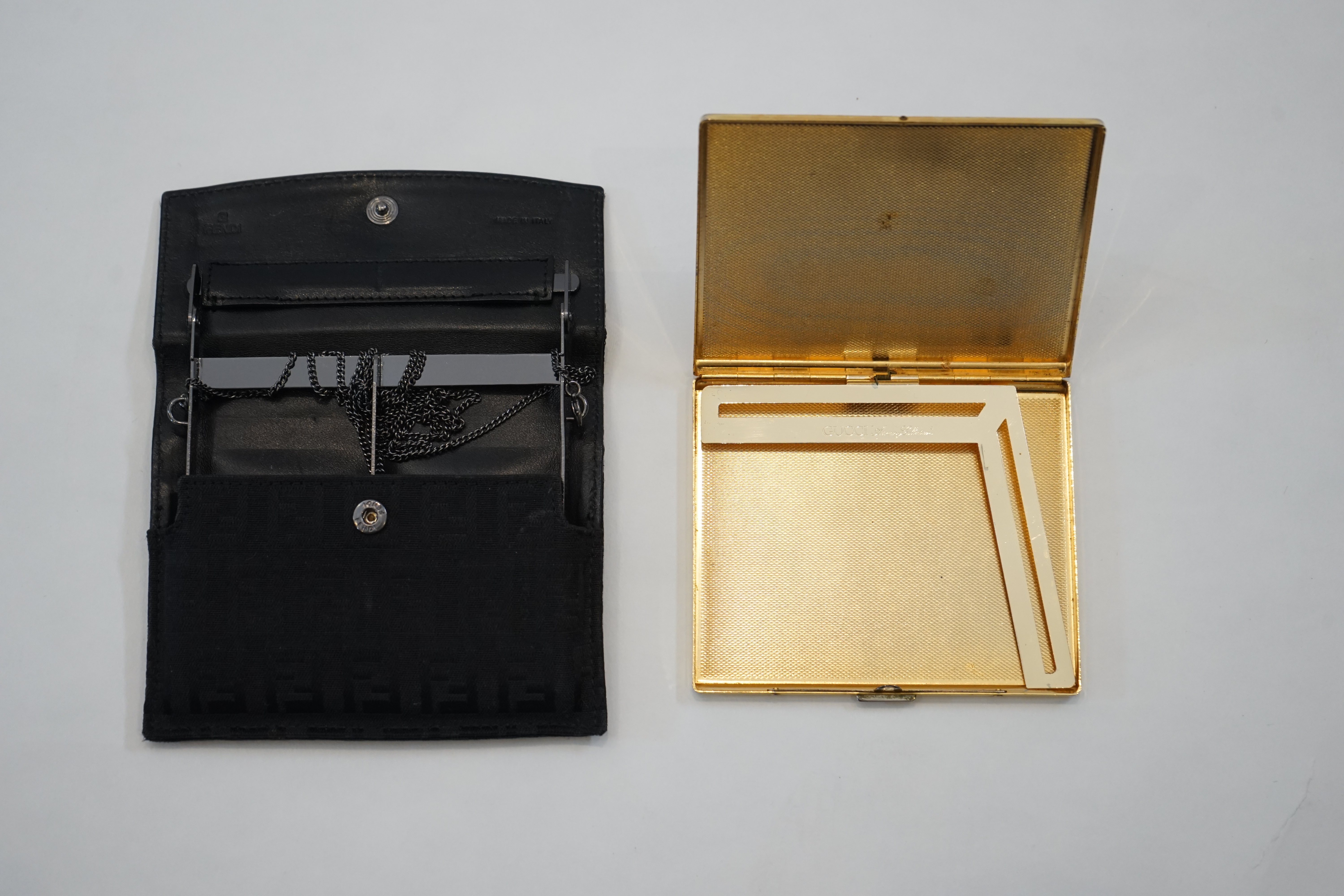 Four Vintage cigarette cases; Fendi, Gucci and two Dior